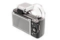 Sony Alpha NEX-5 with SEL1855 lens, screen protector and flash attached