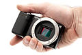 Sony Alpha NEX-5 in male hand