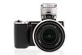 Sony Alpha NEX-5 front view with flash raised